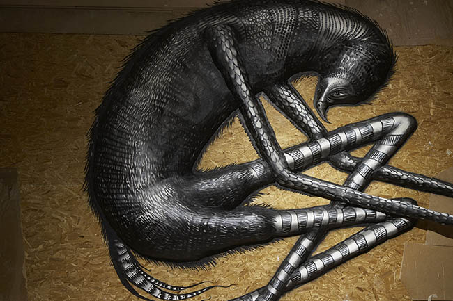 Phlegm will launch a major solo exhibition in London at the  Howard Griffin Gallery. on On the 1st of February. We expect it will be good, the wholesomely named Phlegm is quickly evolving in to a street art muralist of note     The show promises to be rather special event. Phlegm has apparently been working on something specia lover the last couple of months.  The show itself will comprise a large scale installation that is being kept entirely under wraps (besides a  couple of preview shots). The concept behind the show is Phlegm’s take on a medieval Bestiary, here's some wordery from Howard Griffin Gallery website. The Bestiary “A bestiary was an illustrated compendium of animals, half real and half imagined, setting out the natural history of each beast within and its moral significance. A bestiary was not a scientific text and while some beasts and descriptions were quite accurate, others were completely fanciful.  Such bestiarys belonged to the ancient world and were popularised during the Middle Ages as didactic tools. For The Bestiary, Phlegm creates a modern bestiary within his own universe through an immersive and large scale installation in wood, clay and plaster.  Here Phlegm presents a taxonomic categorisation of his creatures and collects them in one place for the first time. Within the expansive sections of the installation, and working in bas and high relief, Phlegm displays a series of works akin to the Lascaux cave paintings. Inspired by the bestiarys of old, these works contain untold fables and narratives.”